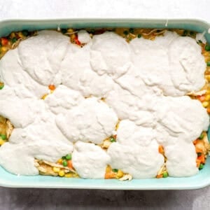 Dollops of biscuit batter on top of the chicken and veggie filling.