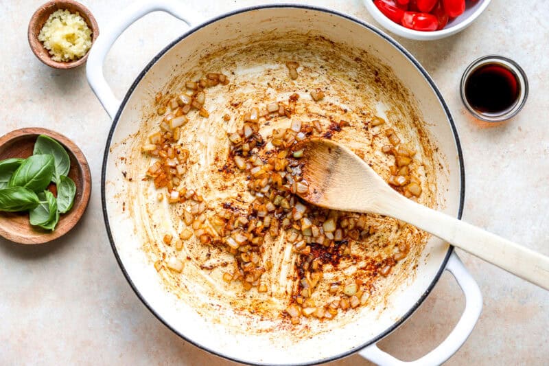 Sautéed garlic and onion in a pan.