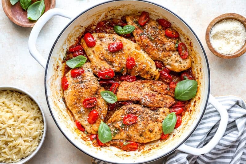 Tomato basil chicken in a pan.