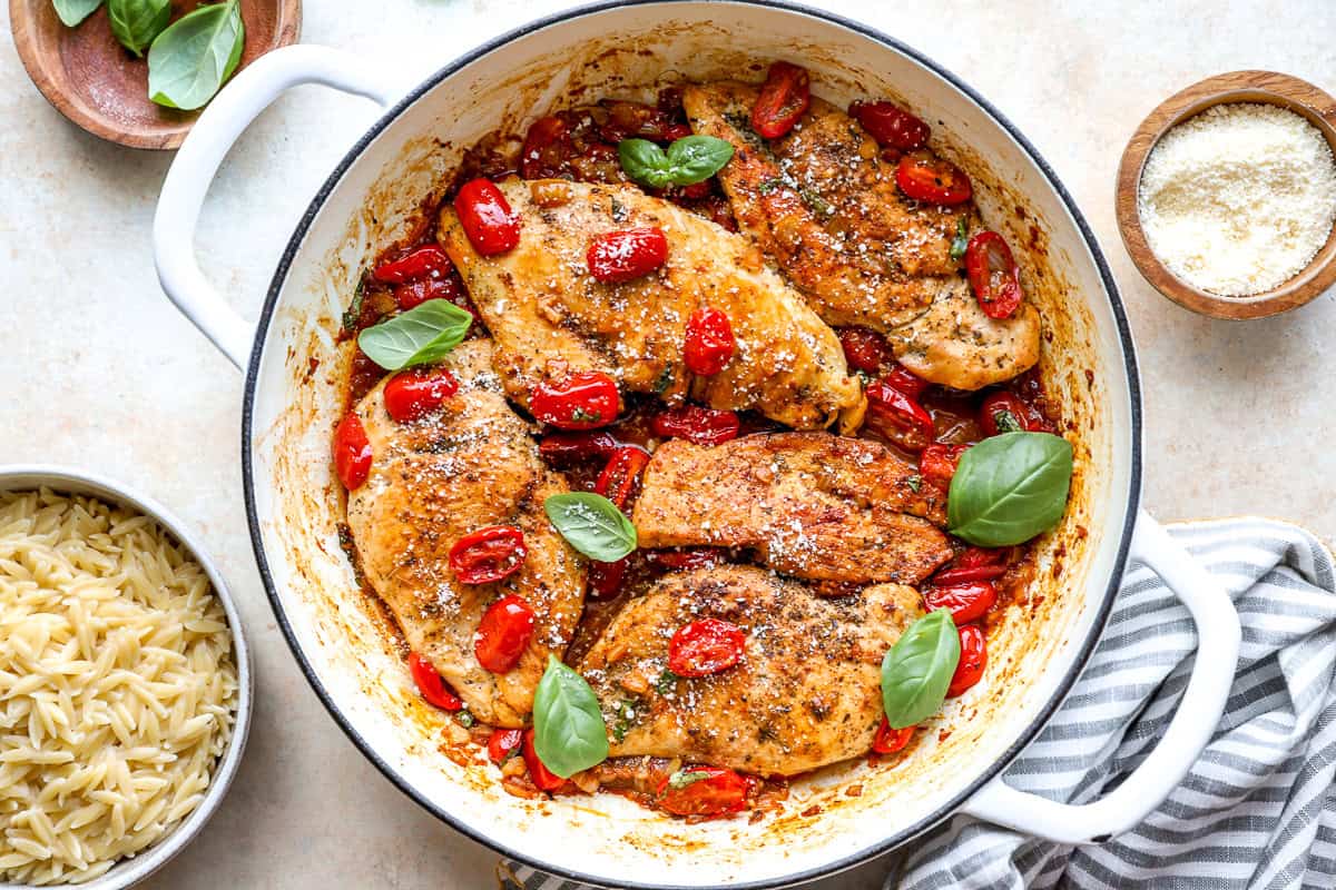 Tomato basil chicken in a pan.