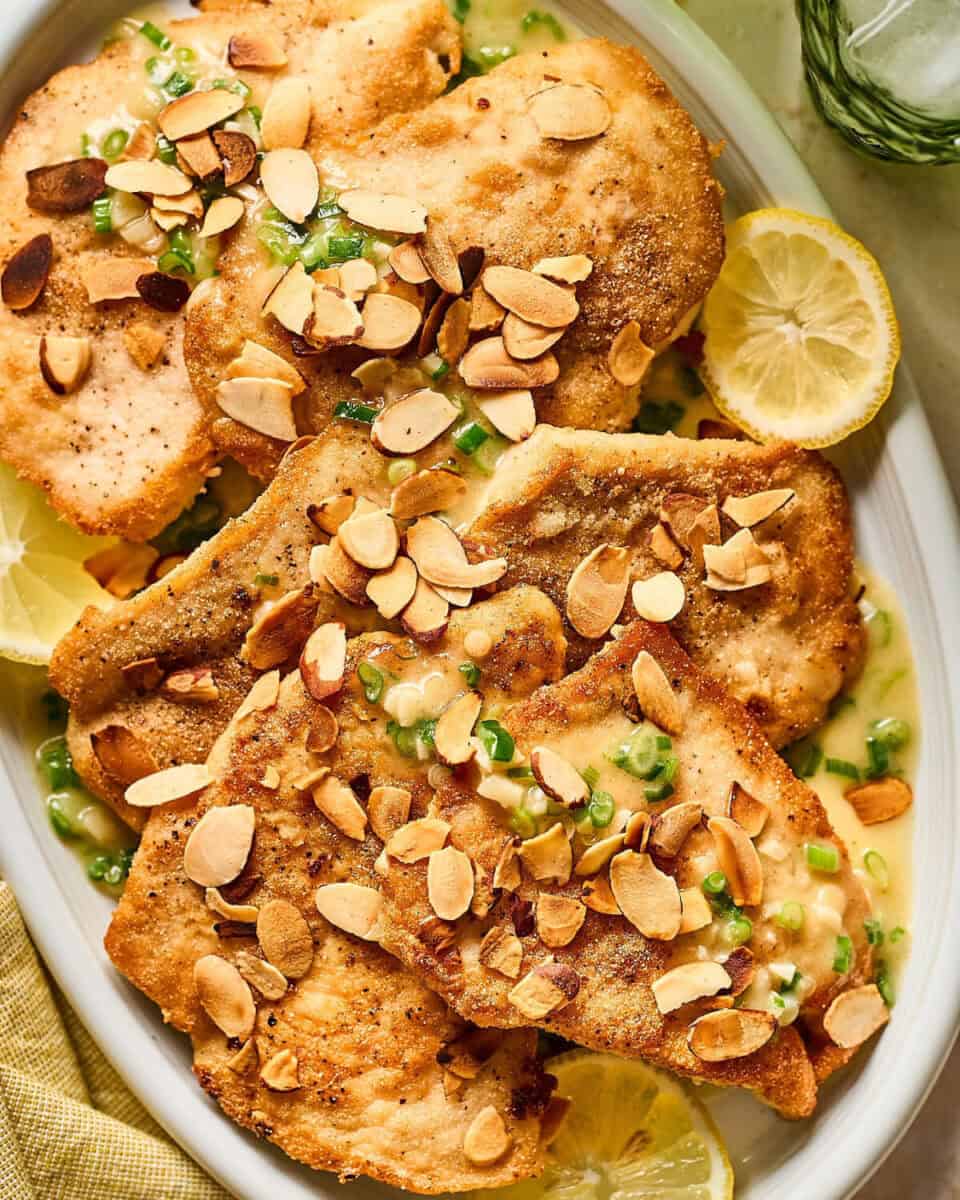 A serving plate of chicken almondine.