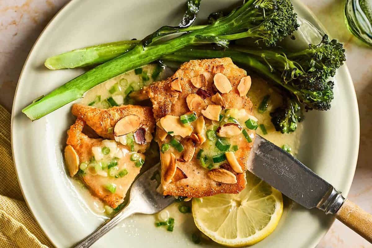 Eating chicken almondine with broccoli.
