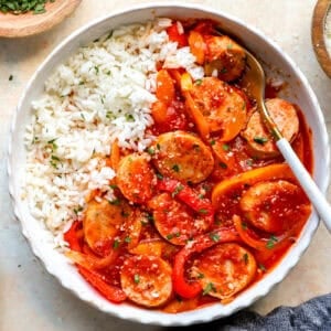 A serving of chicken sausage and peppers with rice.
