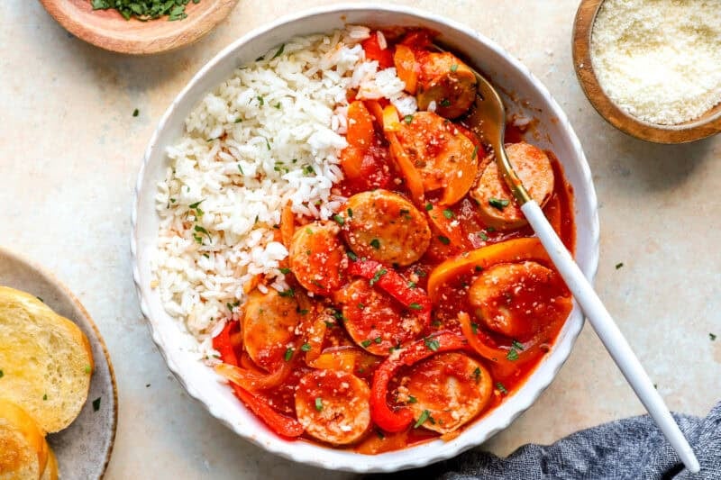 A serving of chicken sausage and peppers with rice.