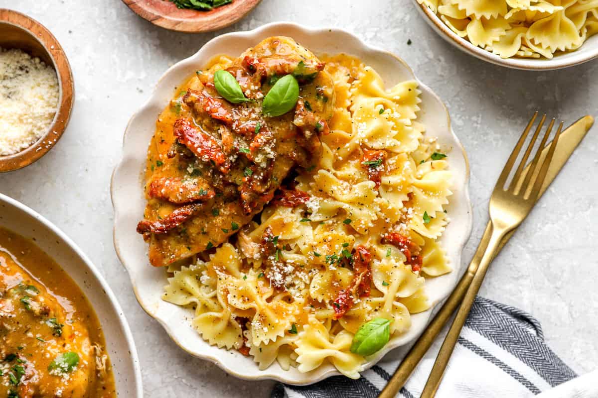 A plate of marry me chicken and pasta.