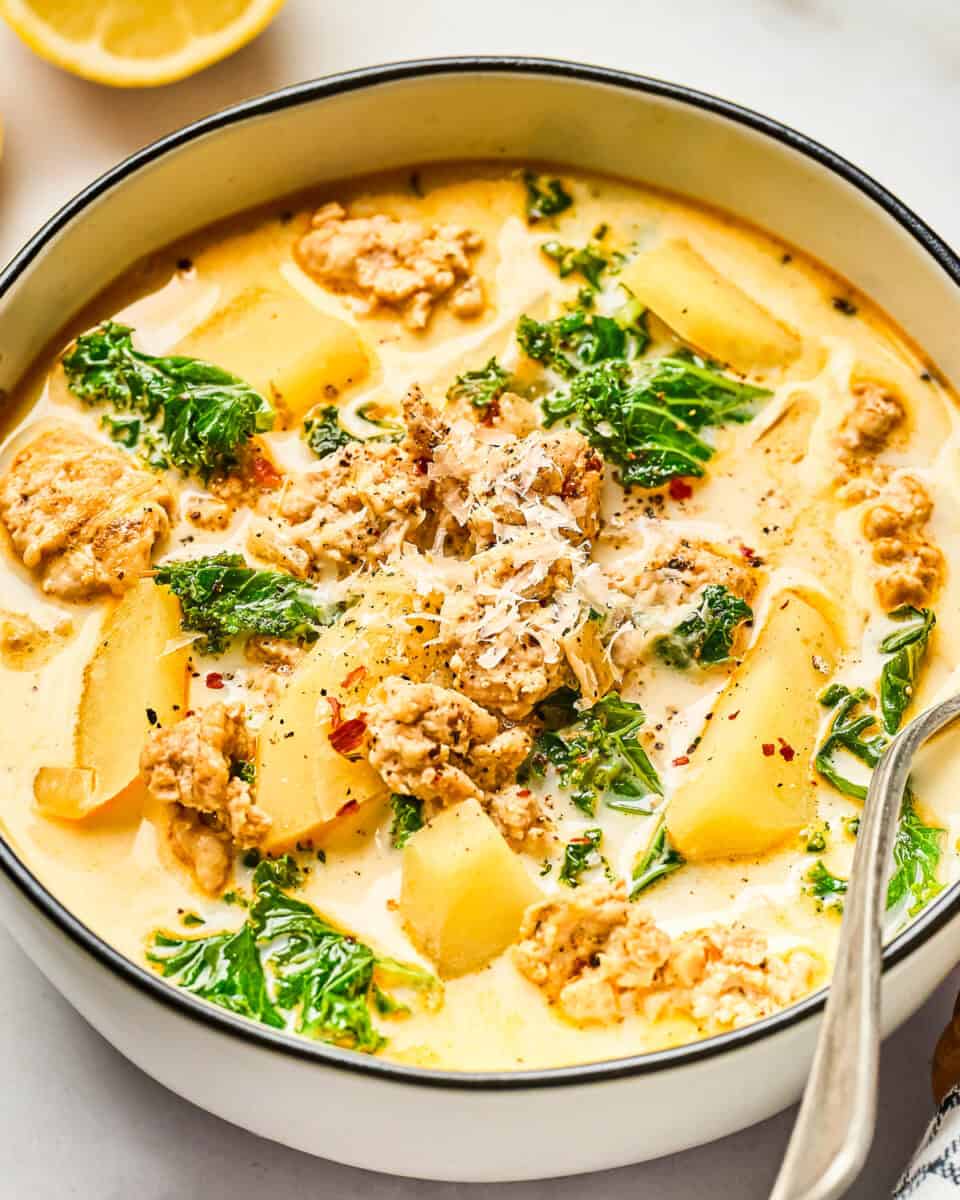 A bowl of creamy Zuppa Toscana with ground chicken.