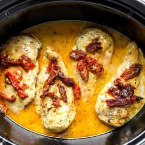 Marry me chicken cooking in a slow cooker.