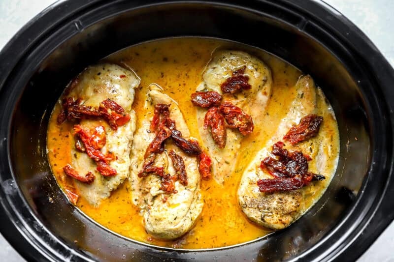 Marry me chicken cooking in a slow cooker.
