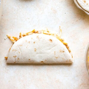 Folded flour chicken taco.