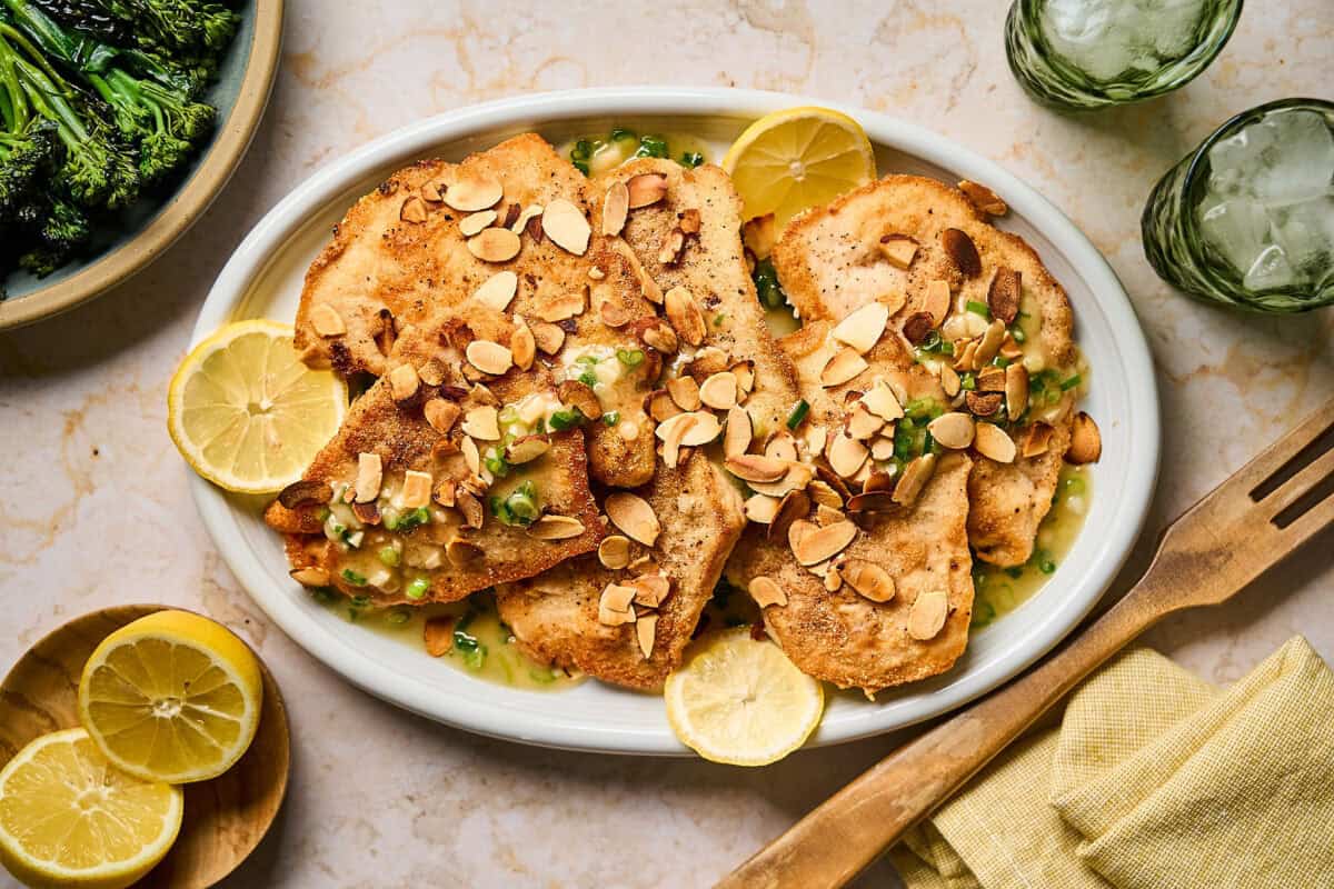 Cooked chicken almondine served on a platter.
