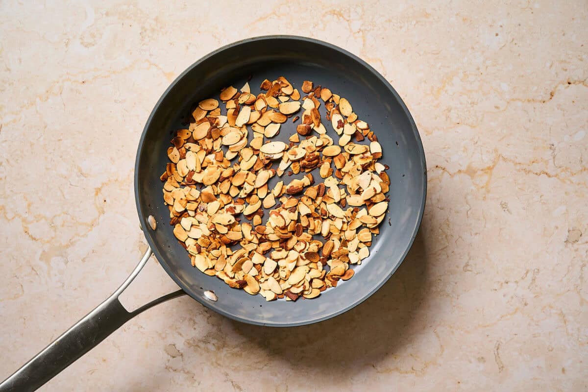 Toasted almonds in a pan.