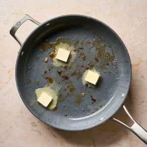 Melting butter in a pan.
