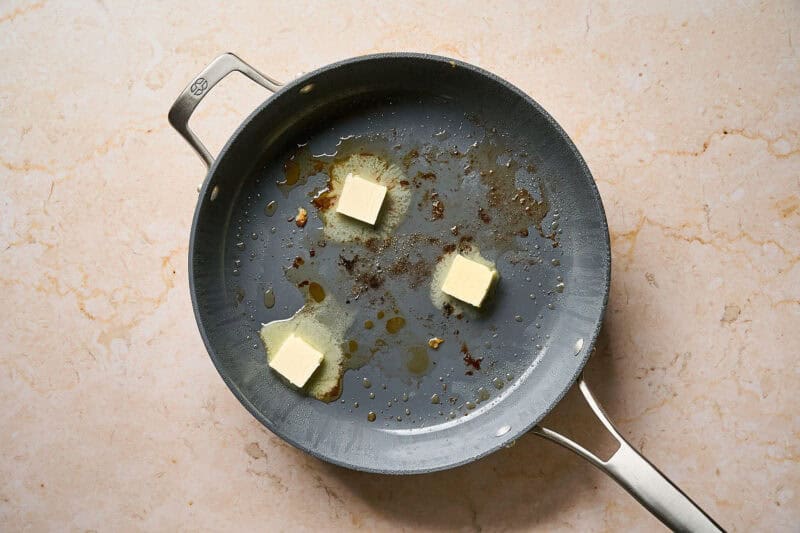 Melting butter in a pan.