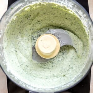 Green goddess dressing in a food processor.