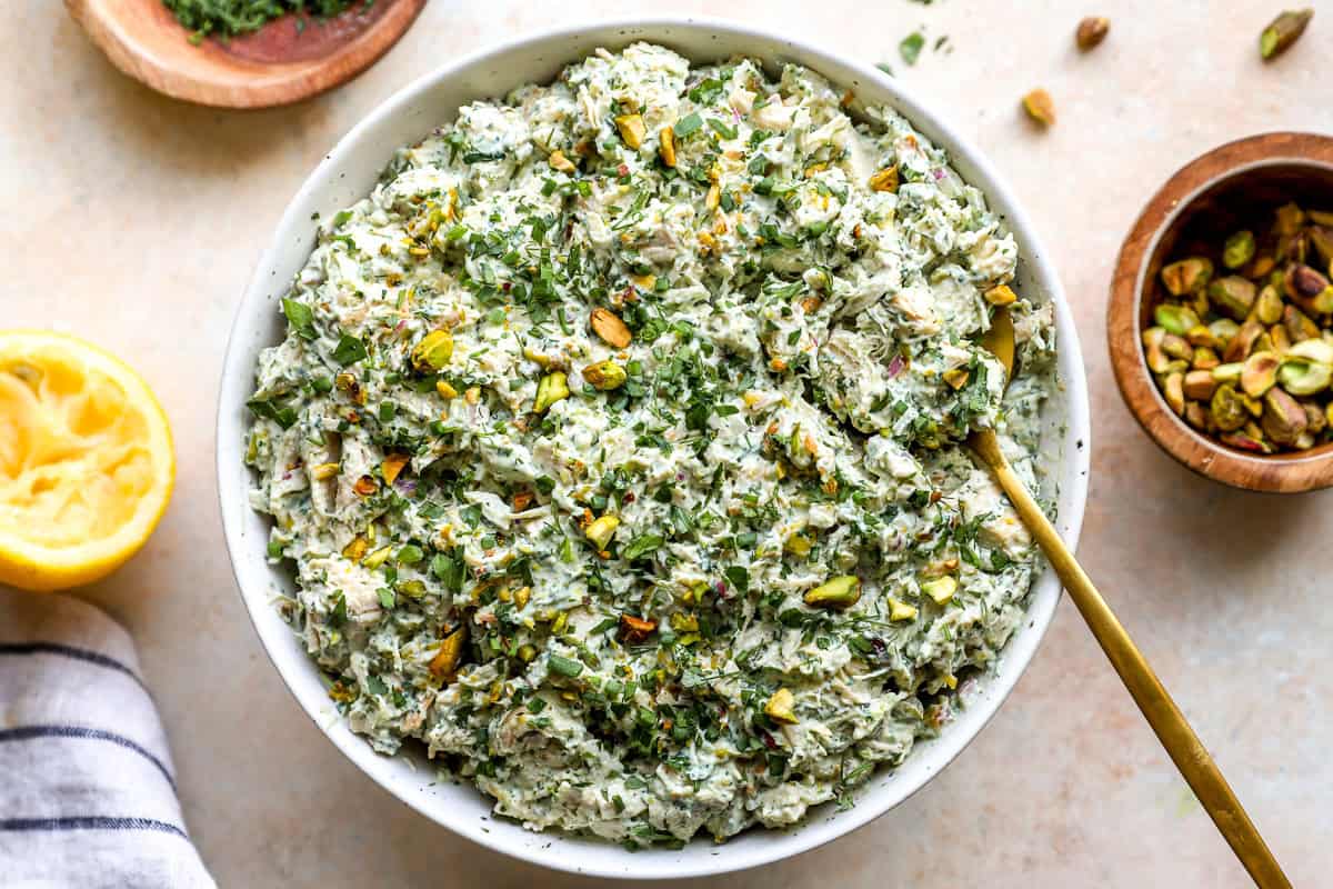 Green goddess chicken salad topped with pistachios.