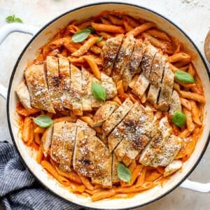 Sliced chicken breast added to the pot of penne alla vodka.
