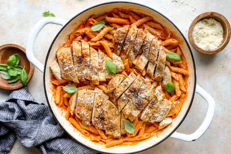 Sliced chicken breast added to the pot of penne alla vodka.