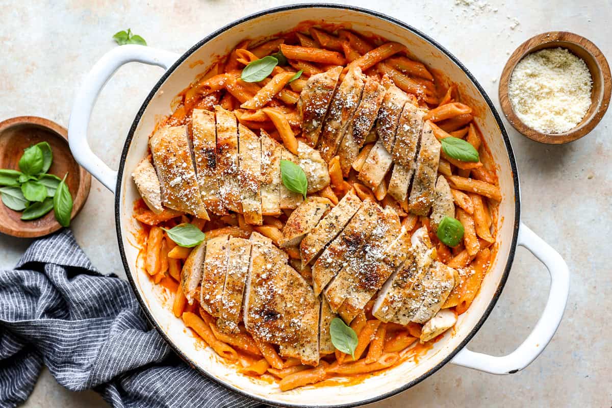Sliced chicken breast added to the pot of penne alla vodka.