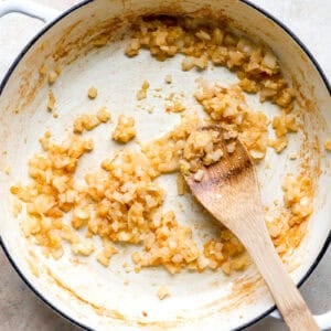 Sautéing onions in a skillet.