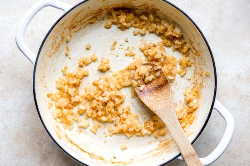 Sautéing onions in a skillet.