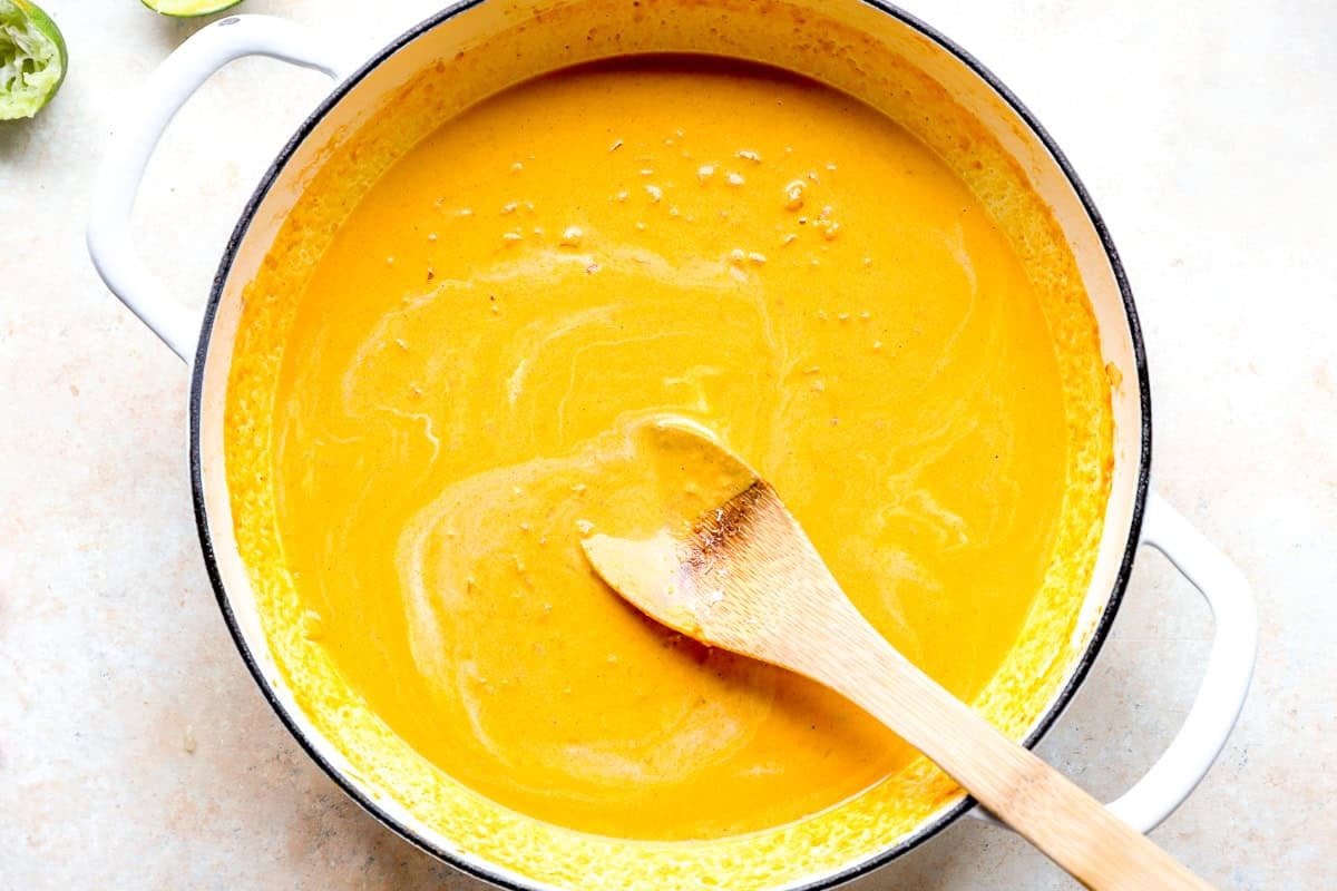 Pumpkin curry mixture cooking in a skillet.