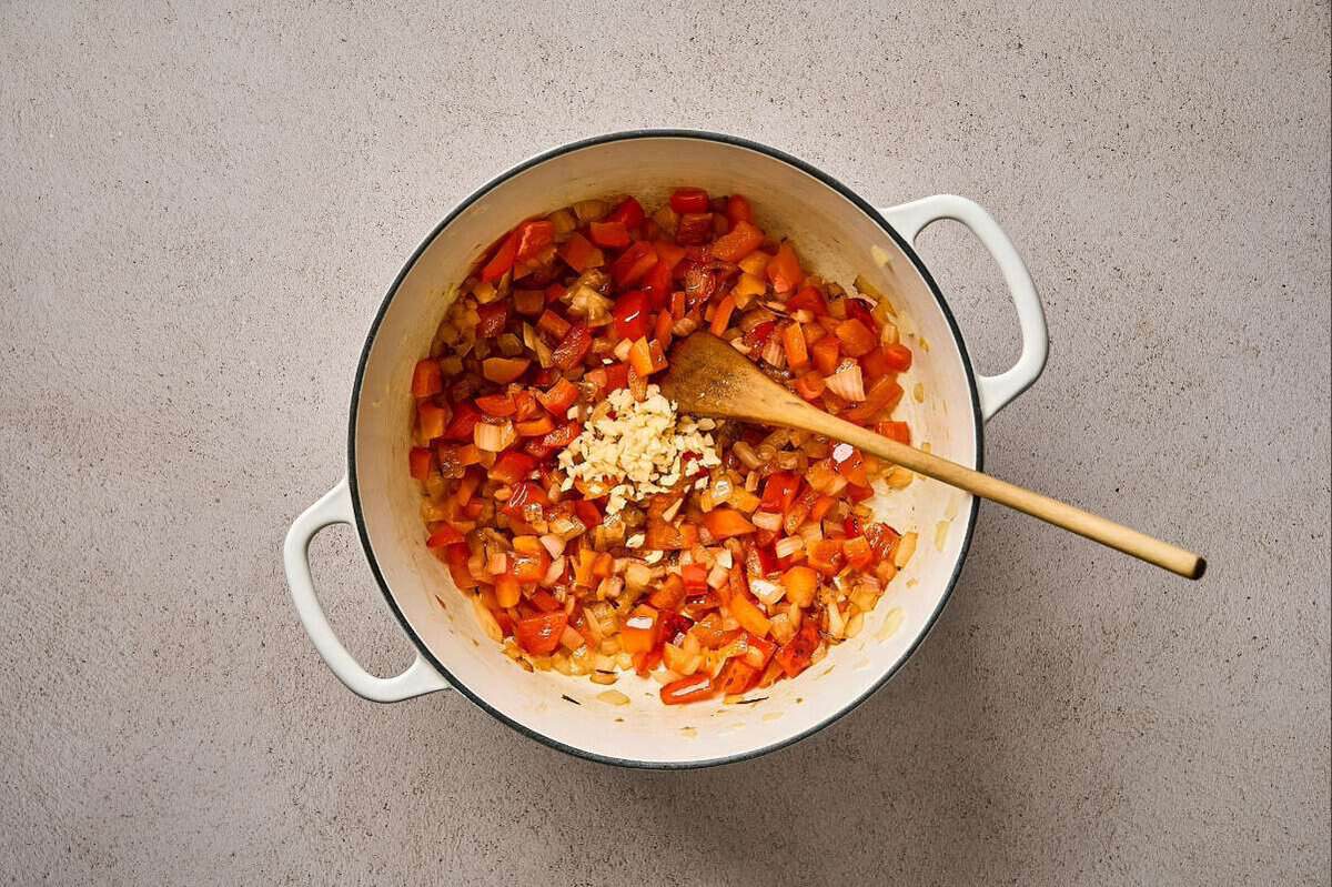 Sautéing veggies in a pot.