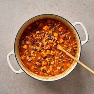 Sweet potato and ground chicken chili cooking in a pot.