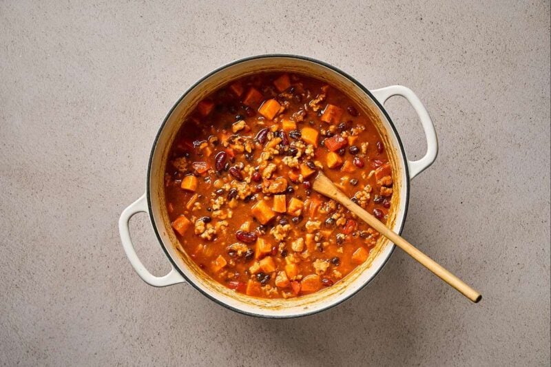 Sweet potato and ground chicken chili cooking in a pot.