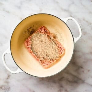 Seasoned ground chicken in a pot.