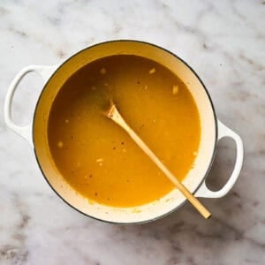 Building soup broth in a pot.
