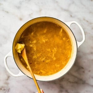 Cooking potatoes in soup broth.