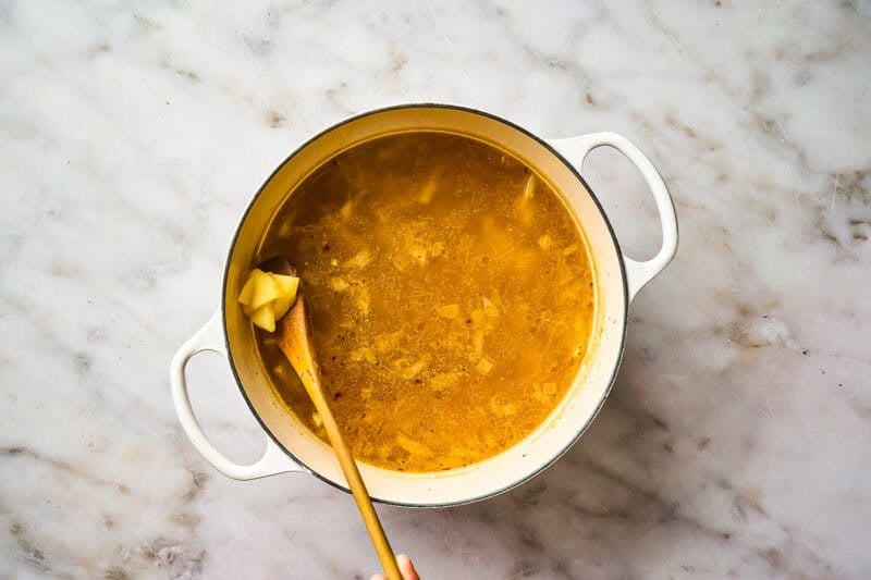 Cooking potatoes in soup broth.