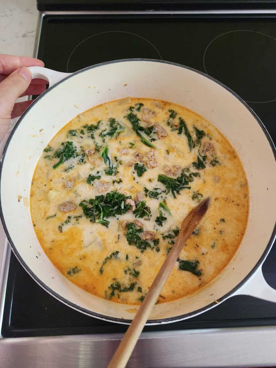 Cooking Zuppa Toscana with chicken on the stovetop.